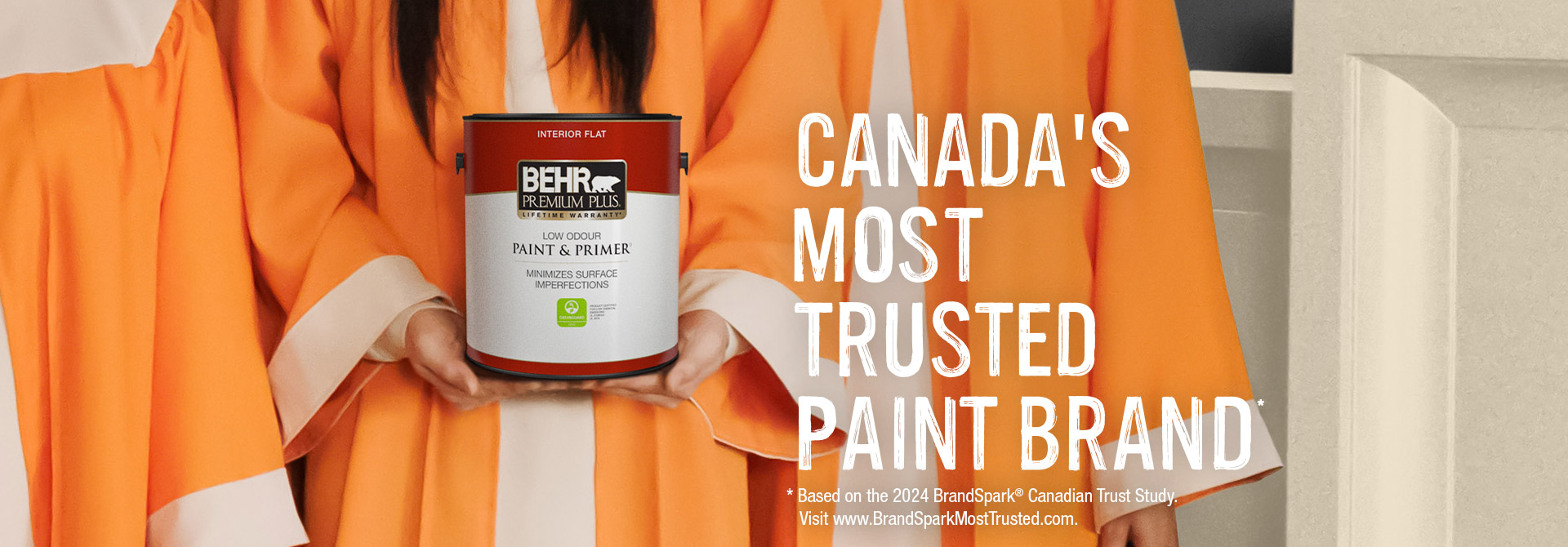 Choir holding a can of Premium Plus Flat interior paint with the words Most Trusted Brand in the foreground