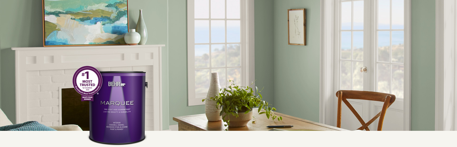 Living room painted in Marquee interior paint with a smiling couple in the background