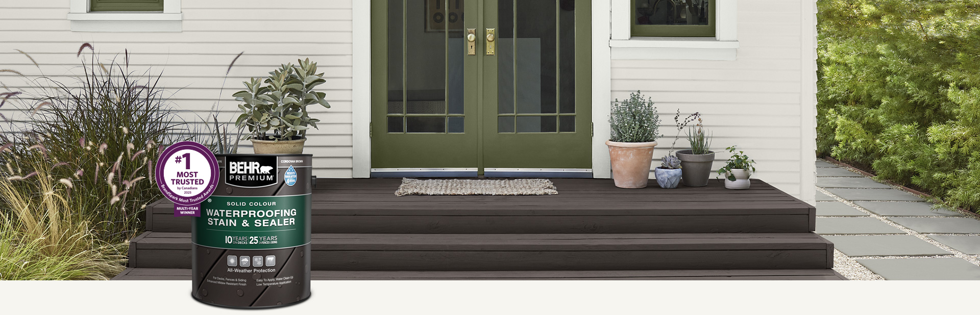 One can of Behr Premium Semi-Transparent wood stain with a wooden deck in the background