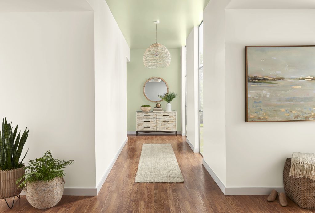A hallway with the back wall painted in an eggshell sheen and the ceiling in a semi-gloss sheen