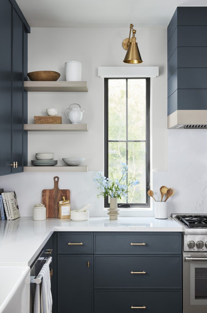 A kitchen with cabinets painted in a deep blue colour in a semi-gloss sheen