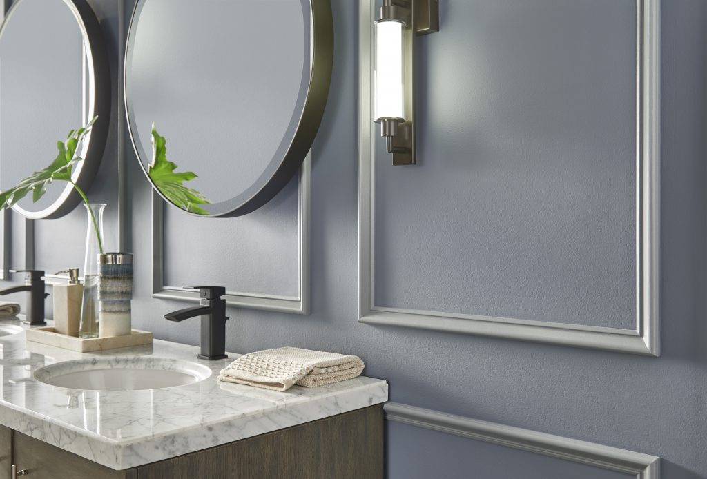 A bathroom with walls and trim painted in a blue-grey colour in a satin sheen