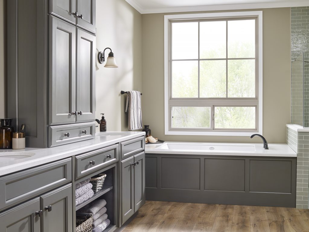 A bathroom with cabinets painted in a grey colour in a hi-gloss sheen