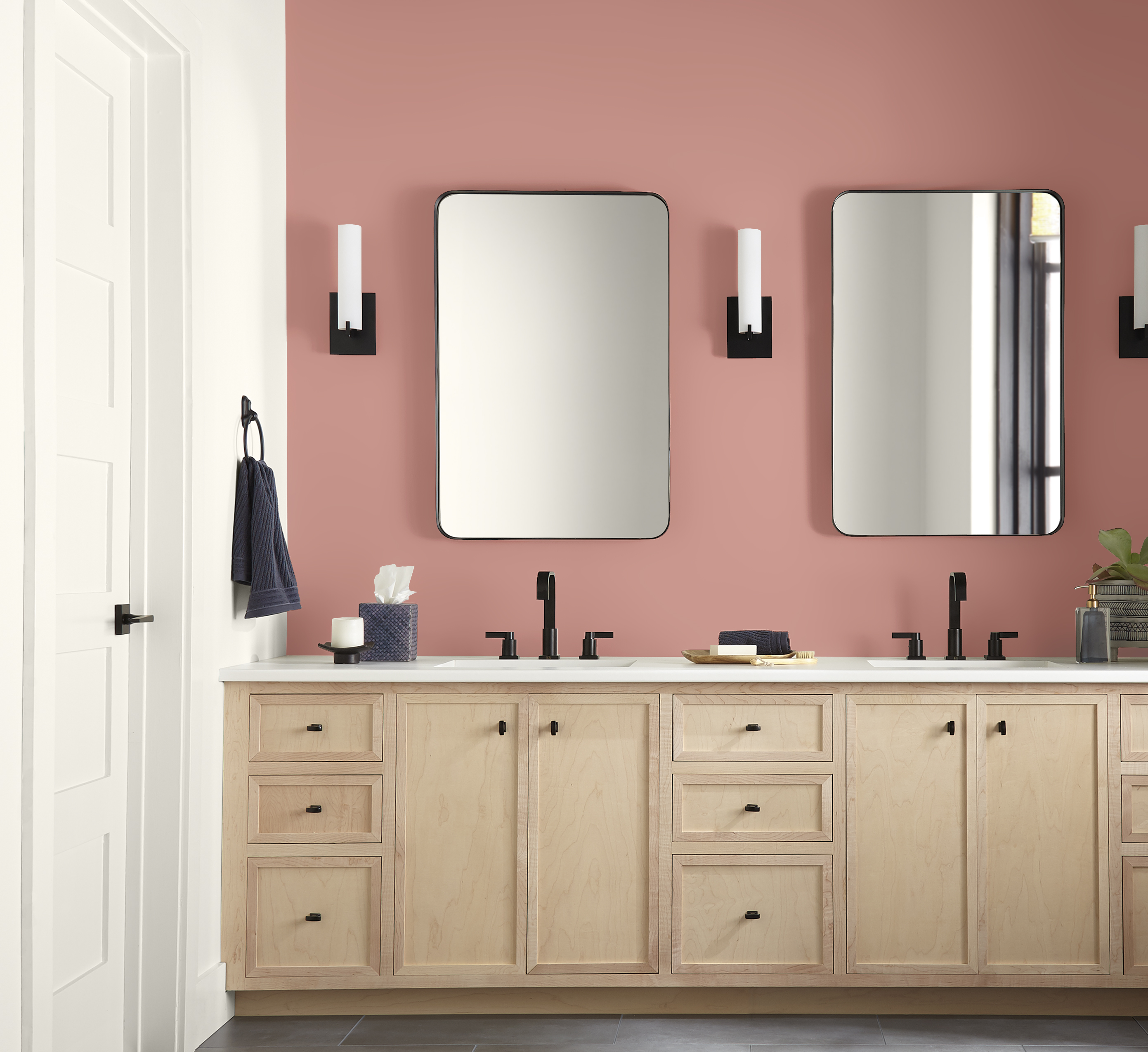 A bathroom with soft dusty pink walls