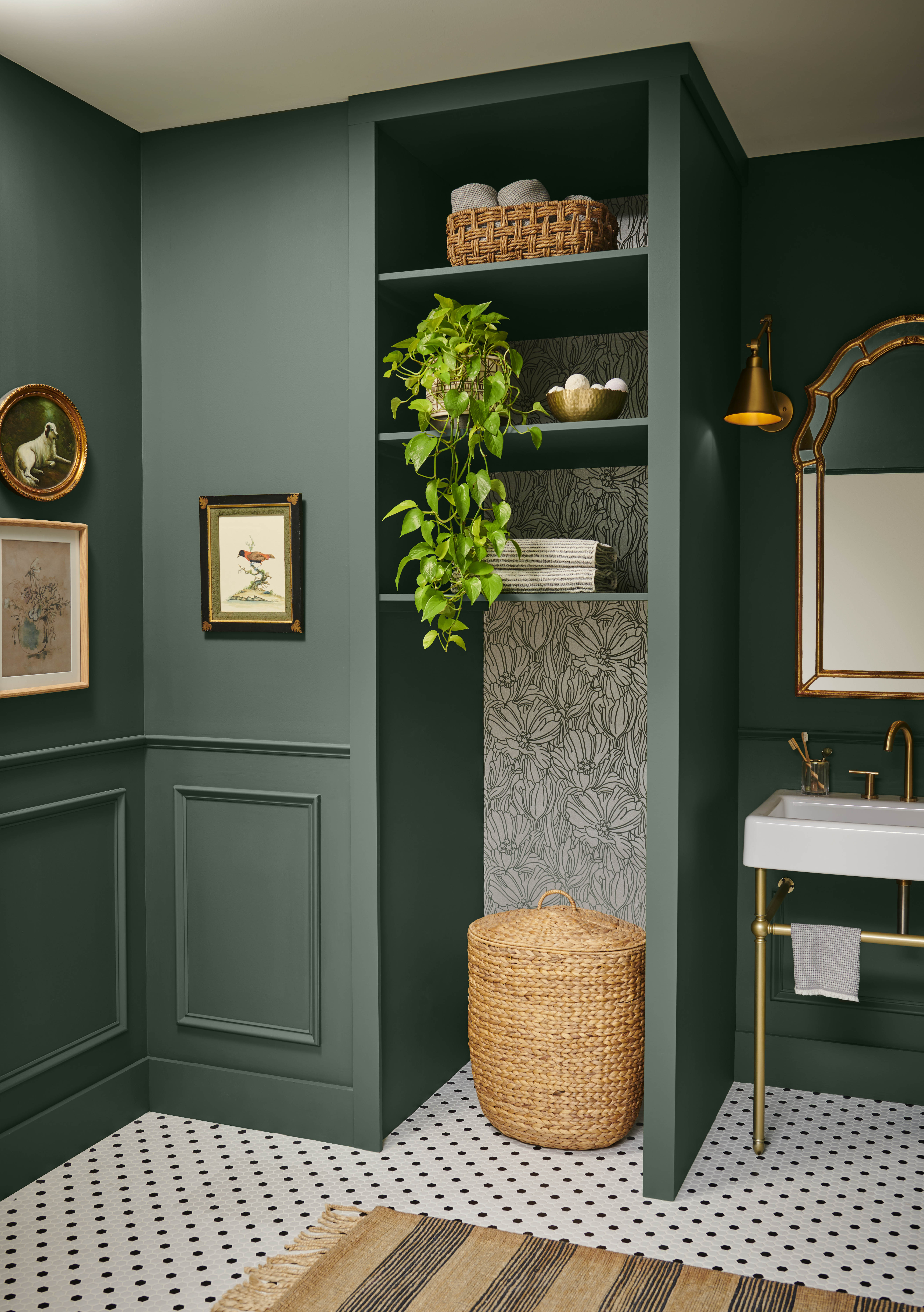 A bathroom painted in a deep green colour.