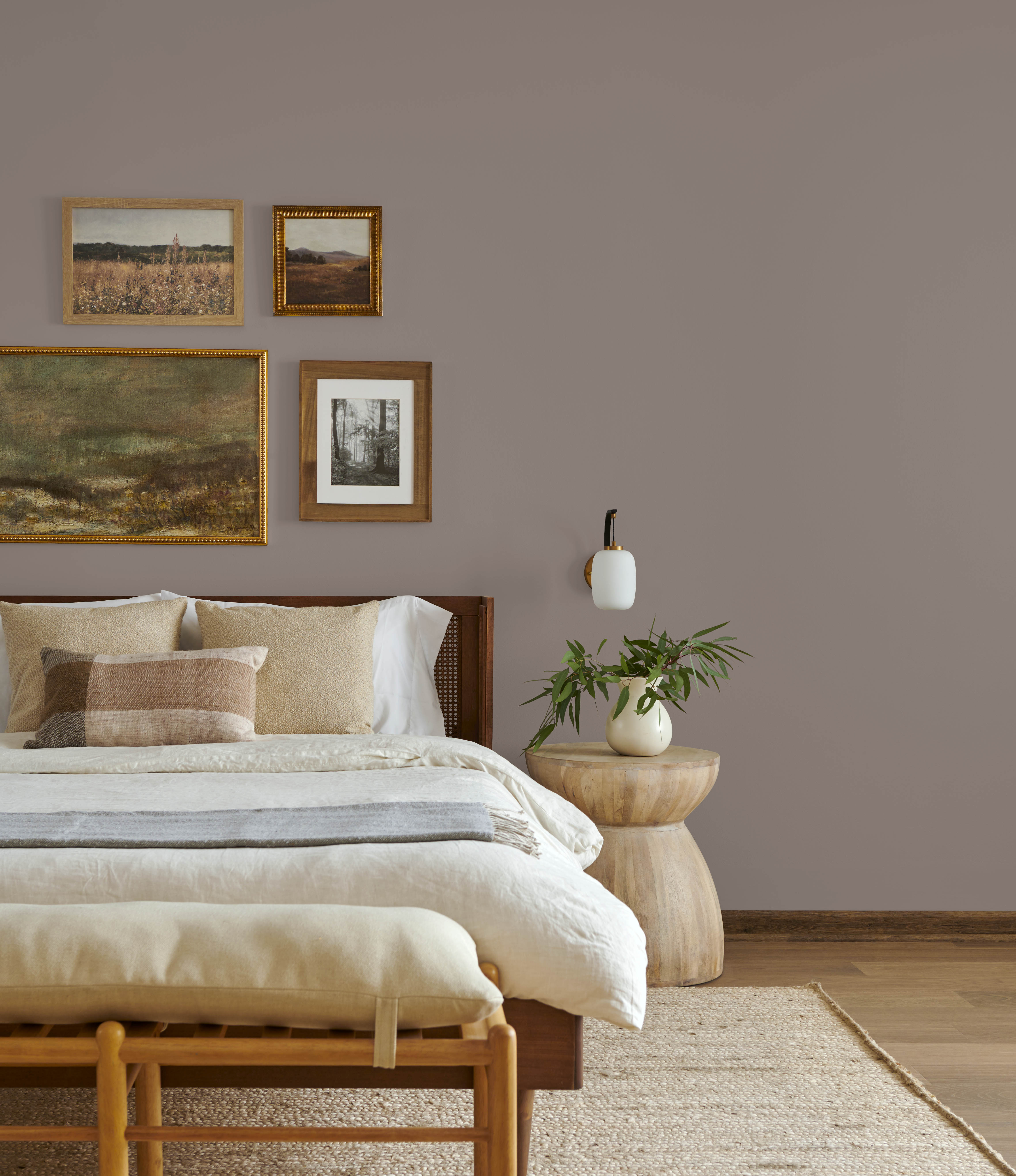 A bedroom with warm brown-grey painted walls.