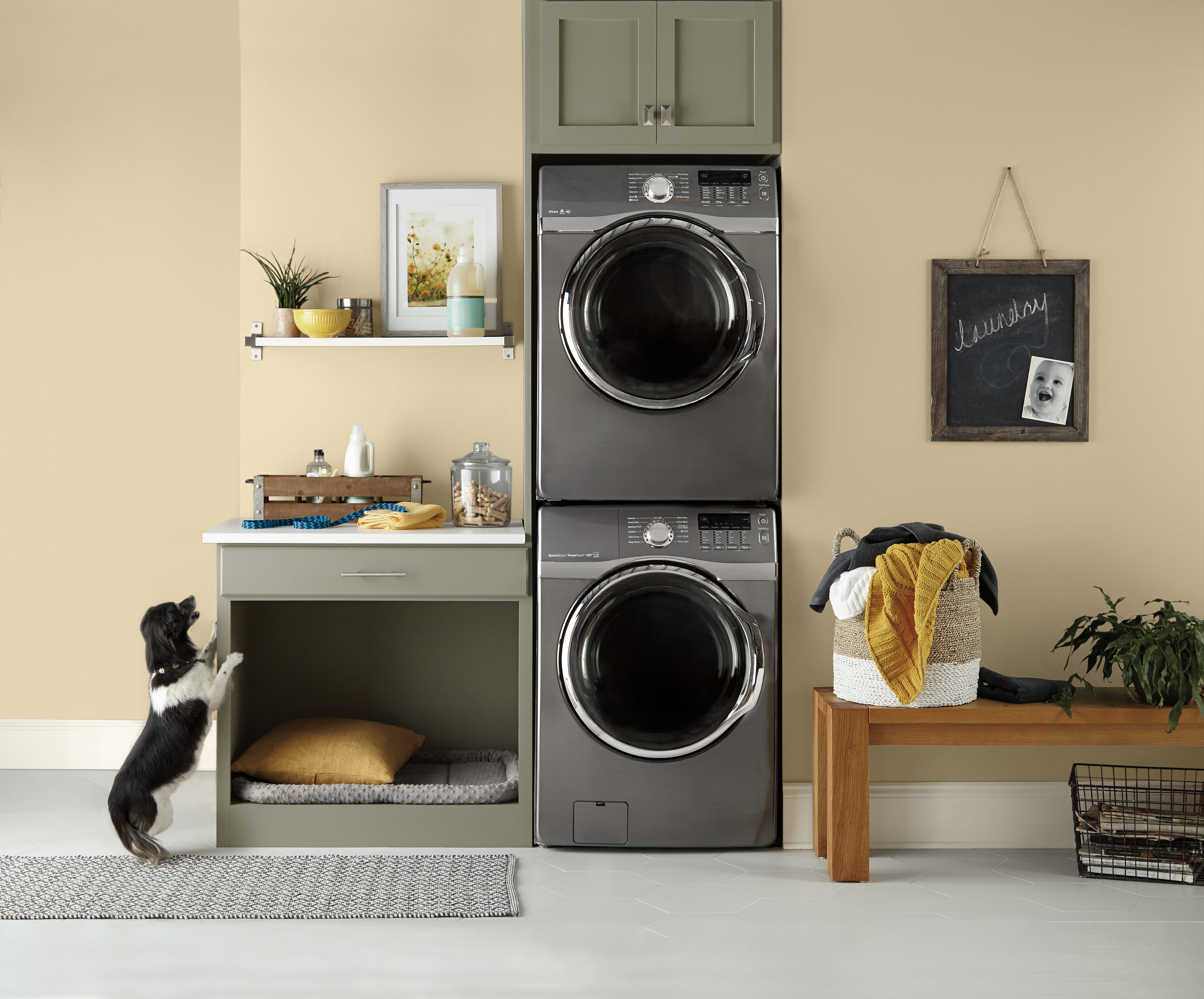 A laundry room painted in a soft yellow