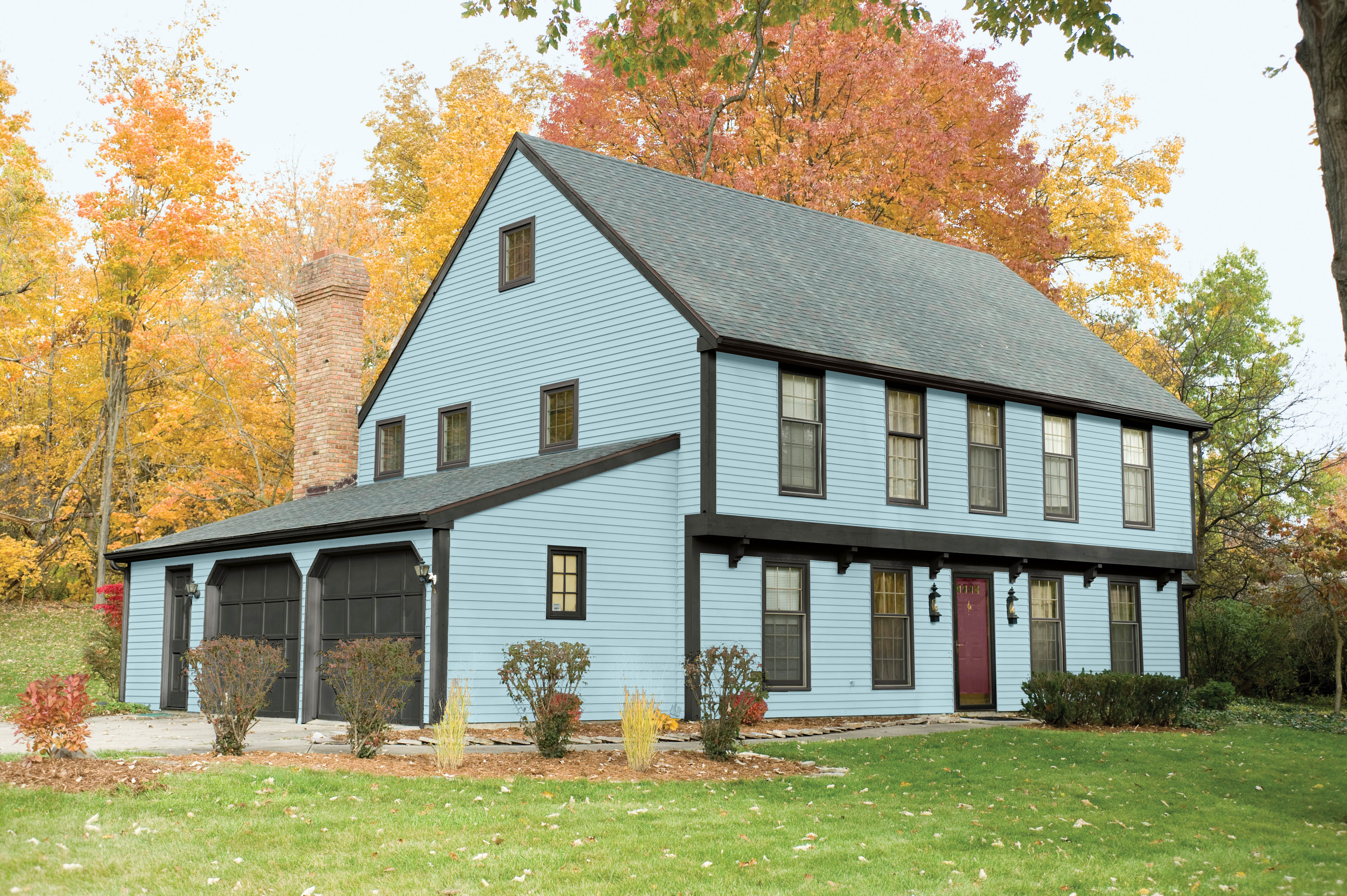 An exterior home painted in a bright but soft hue.