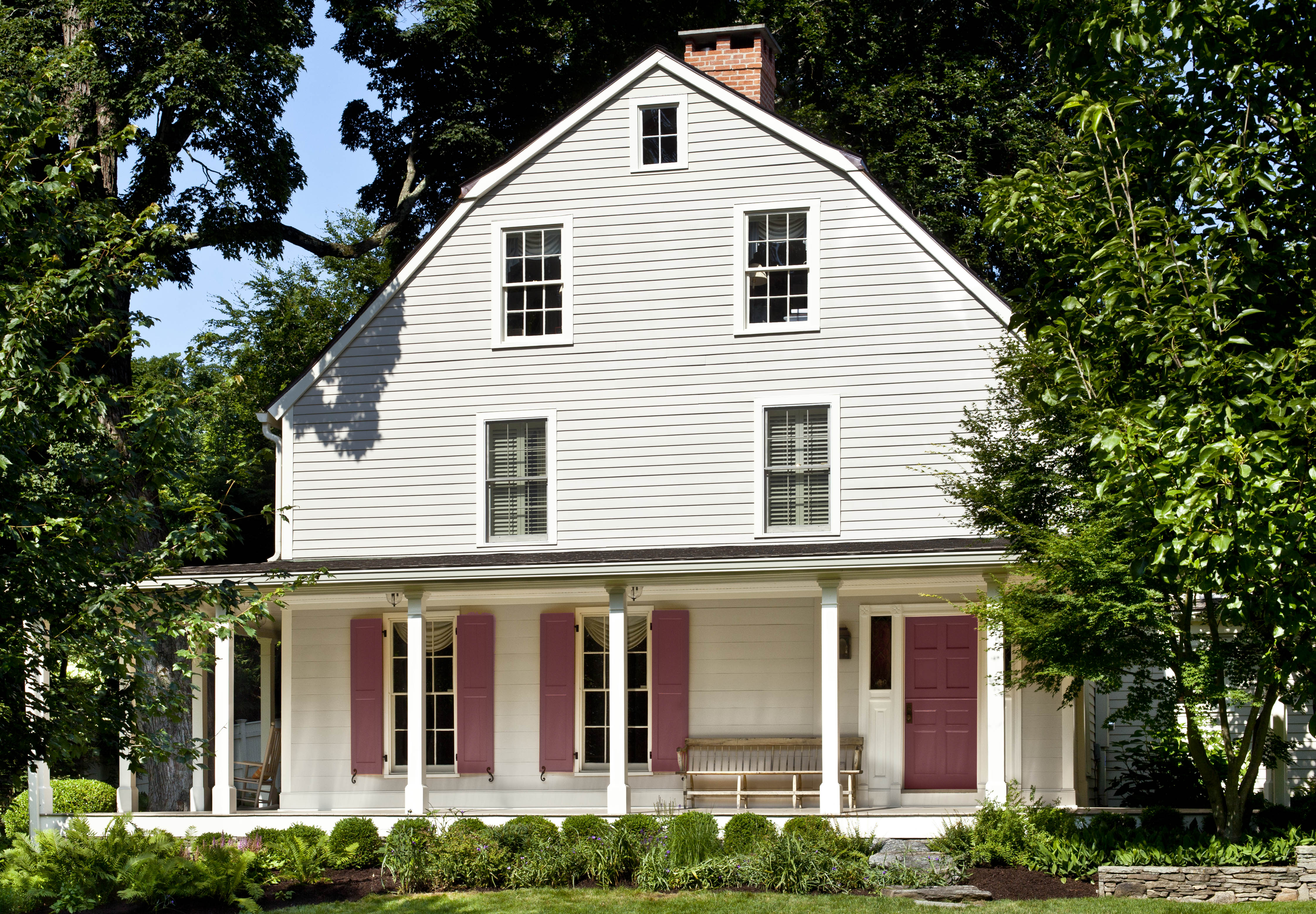 An exterior home painted in a grayed-white hue.