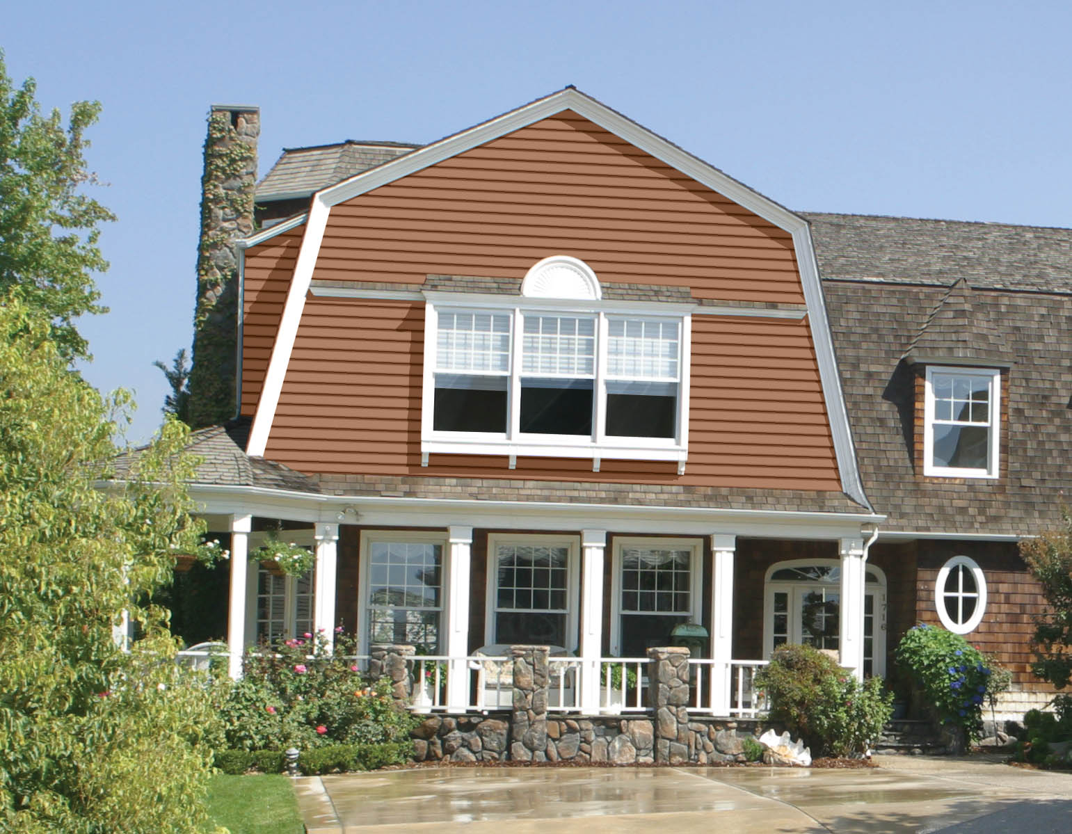 An exterior home painted in a brown-orange hue.