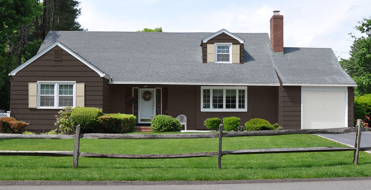 A dark brown ranch-style home with light accents and a well-maintained green lawn that adds vibrant contrast to the dark brown exterior.. Suburban White Home Ranch Style Wood Coral Fence.