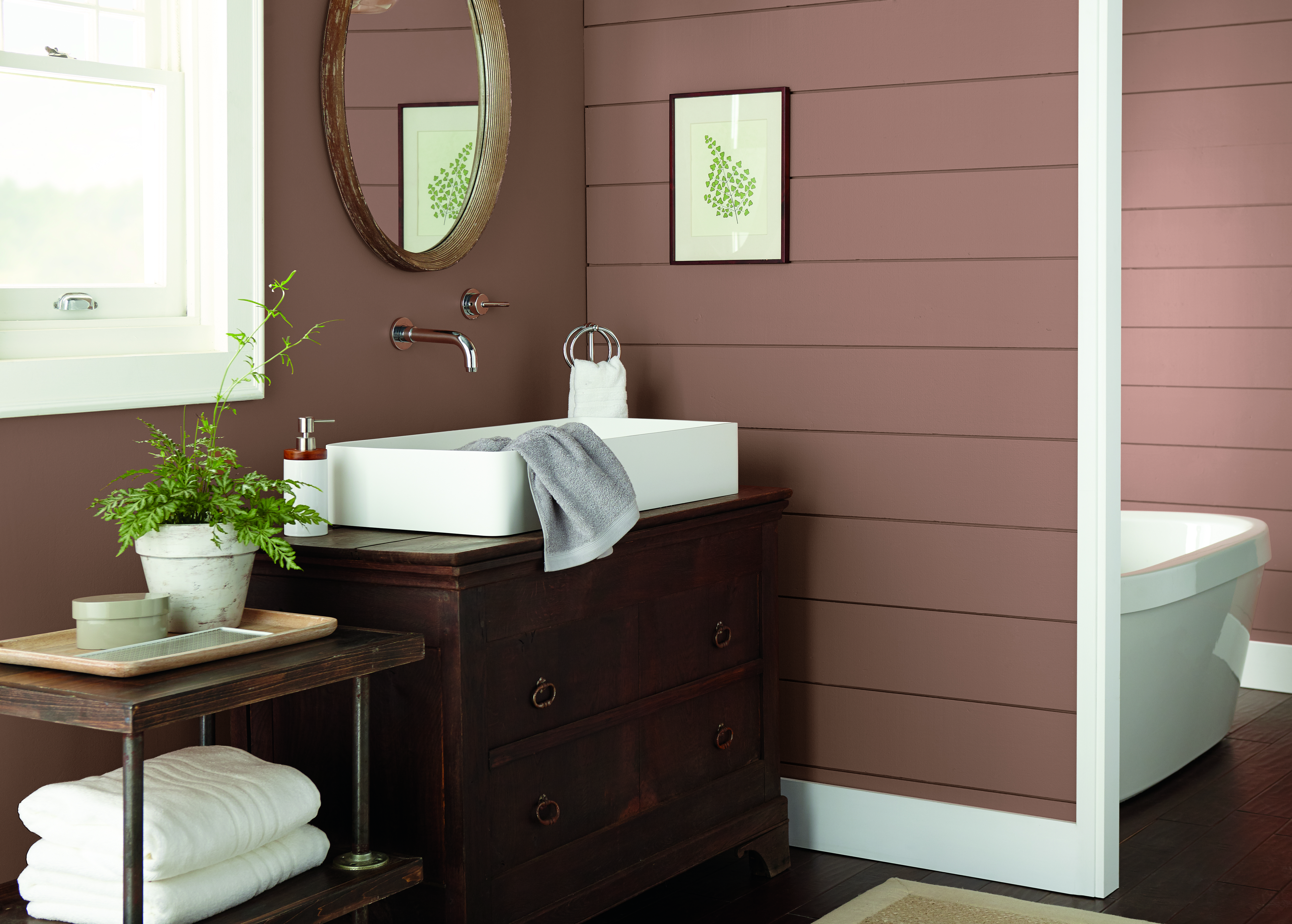 A bathroom with the walls painted in a dusty brown colour.