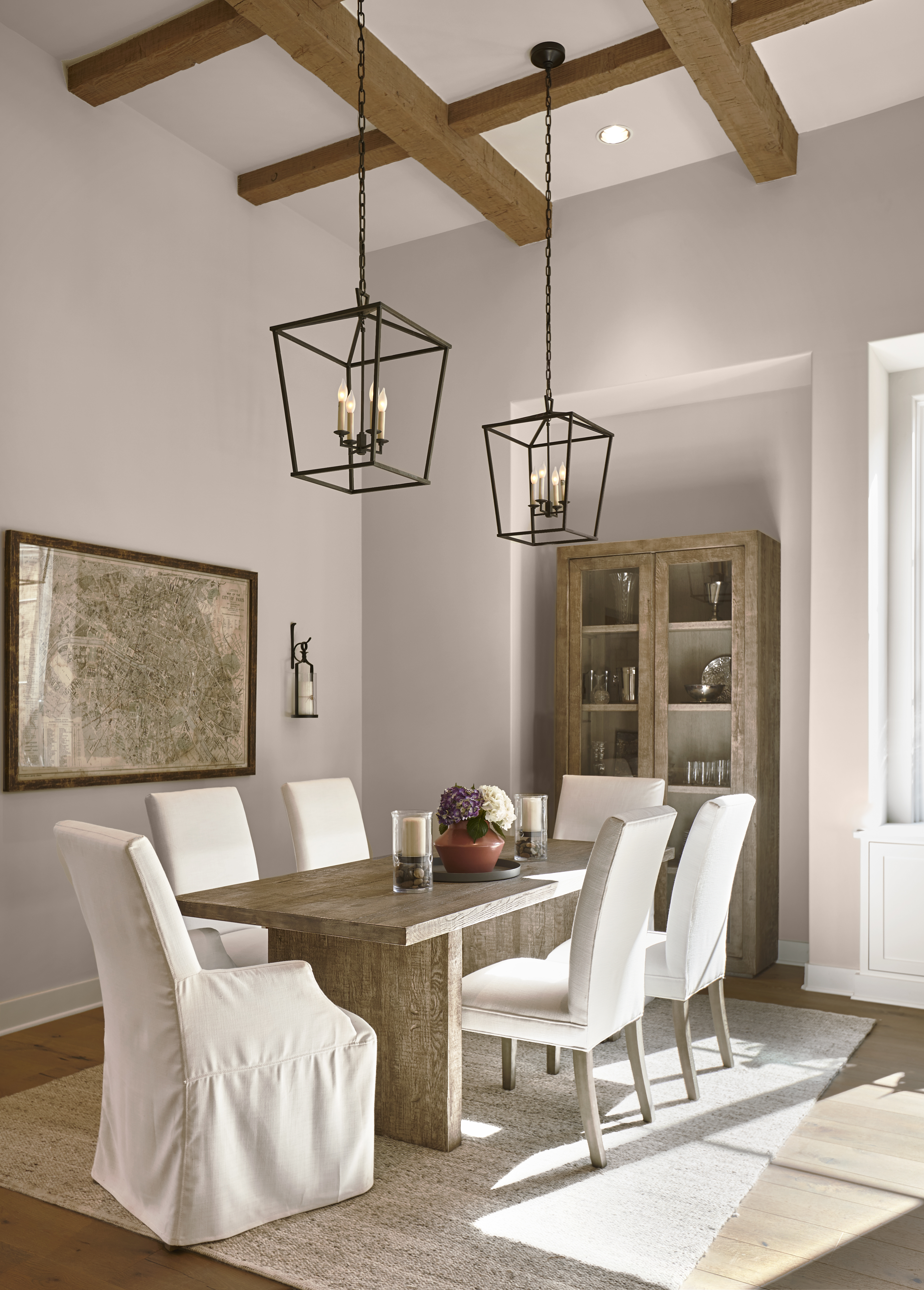 A dining area with the walls painted in a warm taupe.